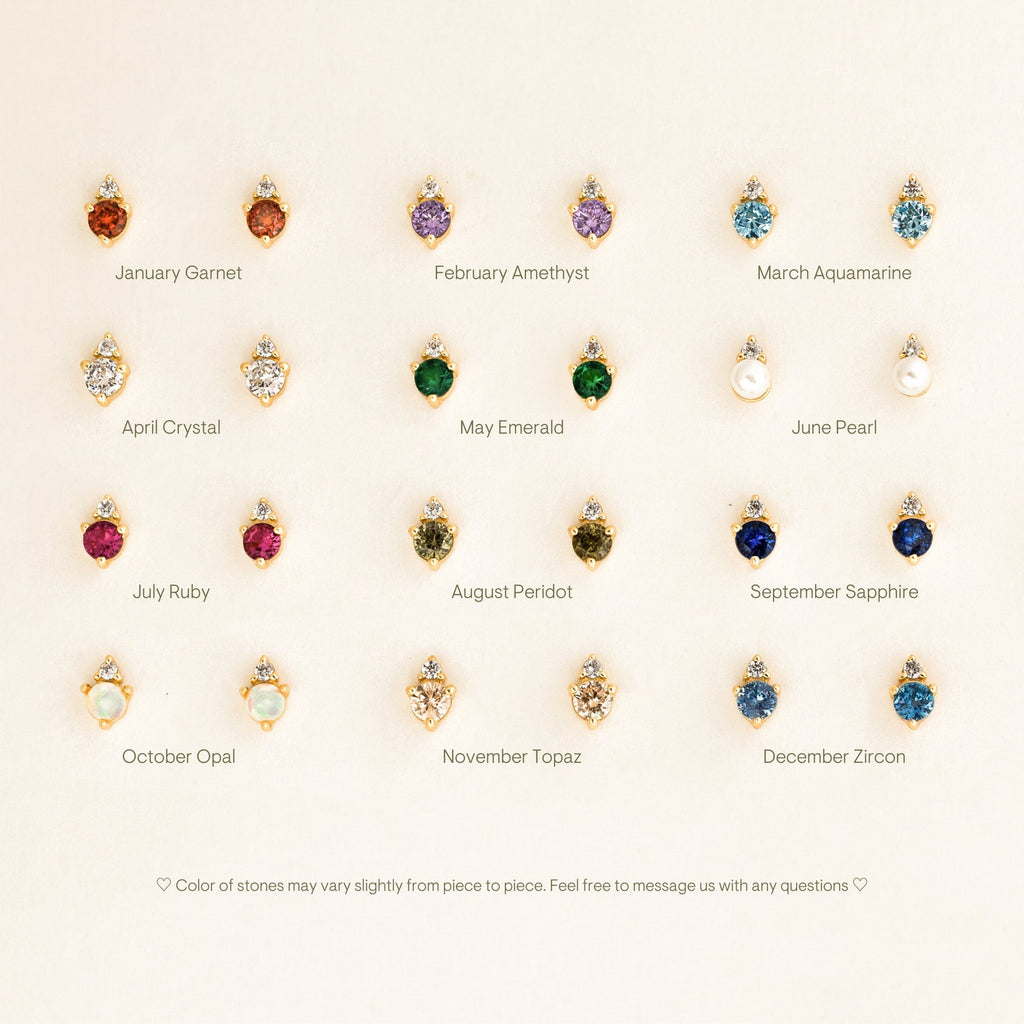 A grid of twelve Raindrop Birthstone Studs pairs, each gold pair labeled by month and gemstone—perfect for anyone who loves dainty earrings.