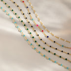 Beaded Station Necklaces with small, colorful beads lined up on gold chains—a fun, playful jewelry choice for any style.