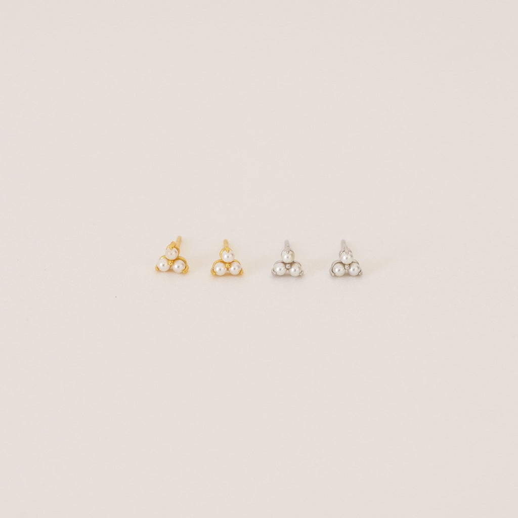 The Maud Pearl Studs feature elegant pearls and small stones, making them a timeless gift and a luxurious jewelry accent for any occasion.