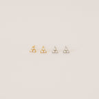 The Maud Pearl Studs feature elegant pearls and small stones, making them a timeless gift and a luxurious jewelry accent for any occasion.