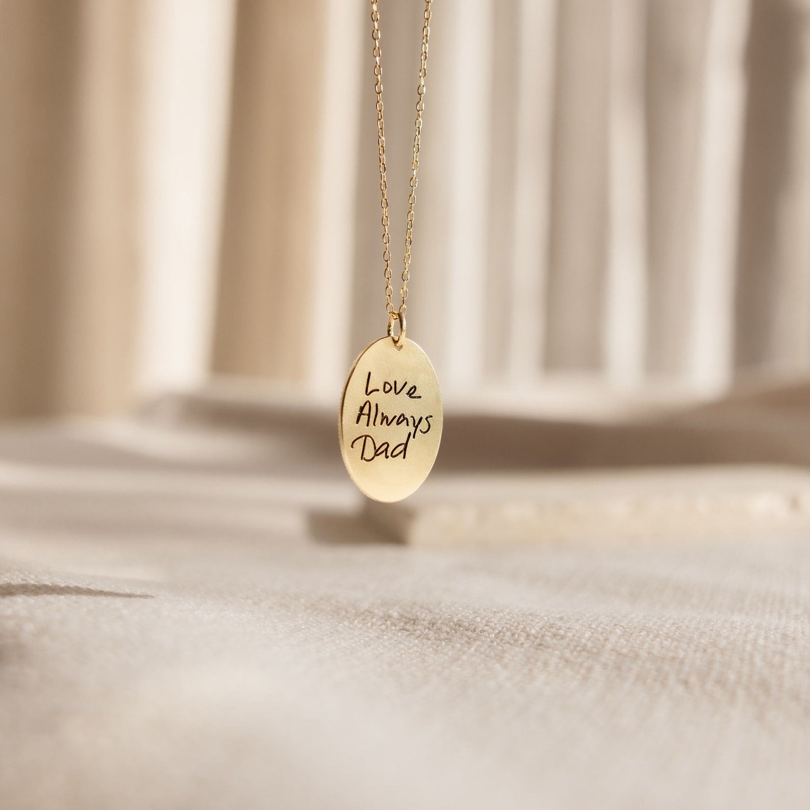 Oval Fingerprint Necklace featuring an engraved oval pendant with "Love Always Dad"—a meaningful piece of memorial jewelry displayed on a soft, neutral background.