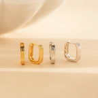 A set of gold and silver earrings, featuring stylish Ribbed Link Hoops and trendy huggie hoops.