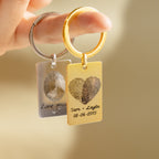 Two Fingerprint Rectangle Keychains—one gold with "Sam + Layla 08-06-2015" and one silver—create a meaningful personalized keepsake.
