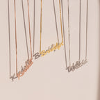 Three Casella Name Necklaces in box chains, each personalized with Kendall, Brooklyn, and Dakota in a dainty script font, hang elegantly—perfect as a custom gift.