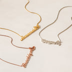 Three Butterfly Name Necklaces in Box Chain, each featuring a delicate butterfly charm, are beautifully displayed in gold, silver, and rose gold on a light surface.