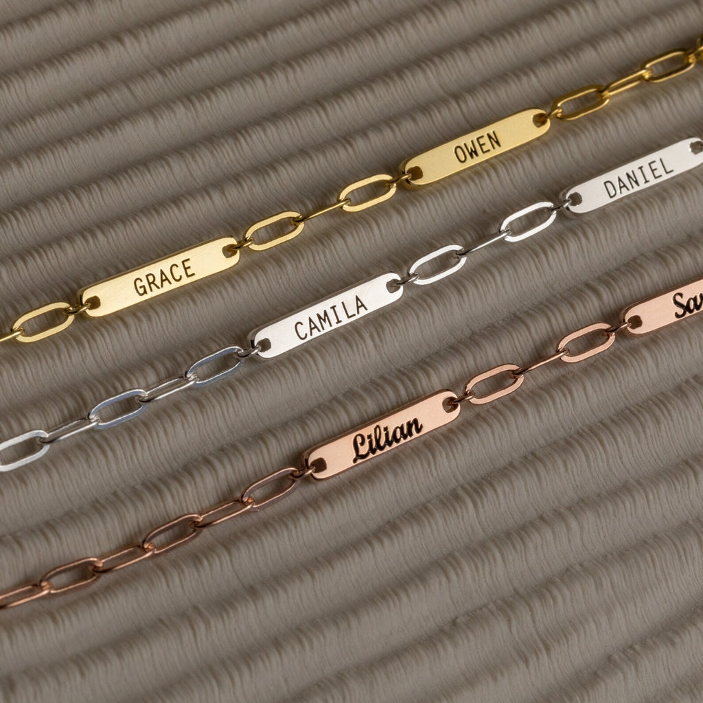 Three metal chain bracelets with nameplates—Grace, Owen, Camila, Daniel, Lilian, and Sam—ideal for stacking or pairing with a Mini Name Bar Necklace to create your unique style.