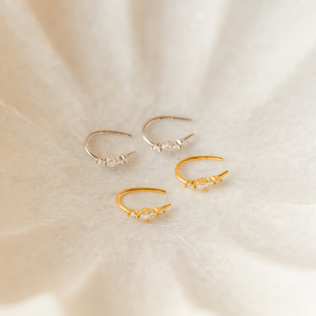 The Amaya Marquise Threaders are dainty gold and silver earrings with elegant diamond cluster designs, perfect for those who love refined jewelry.