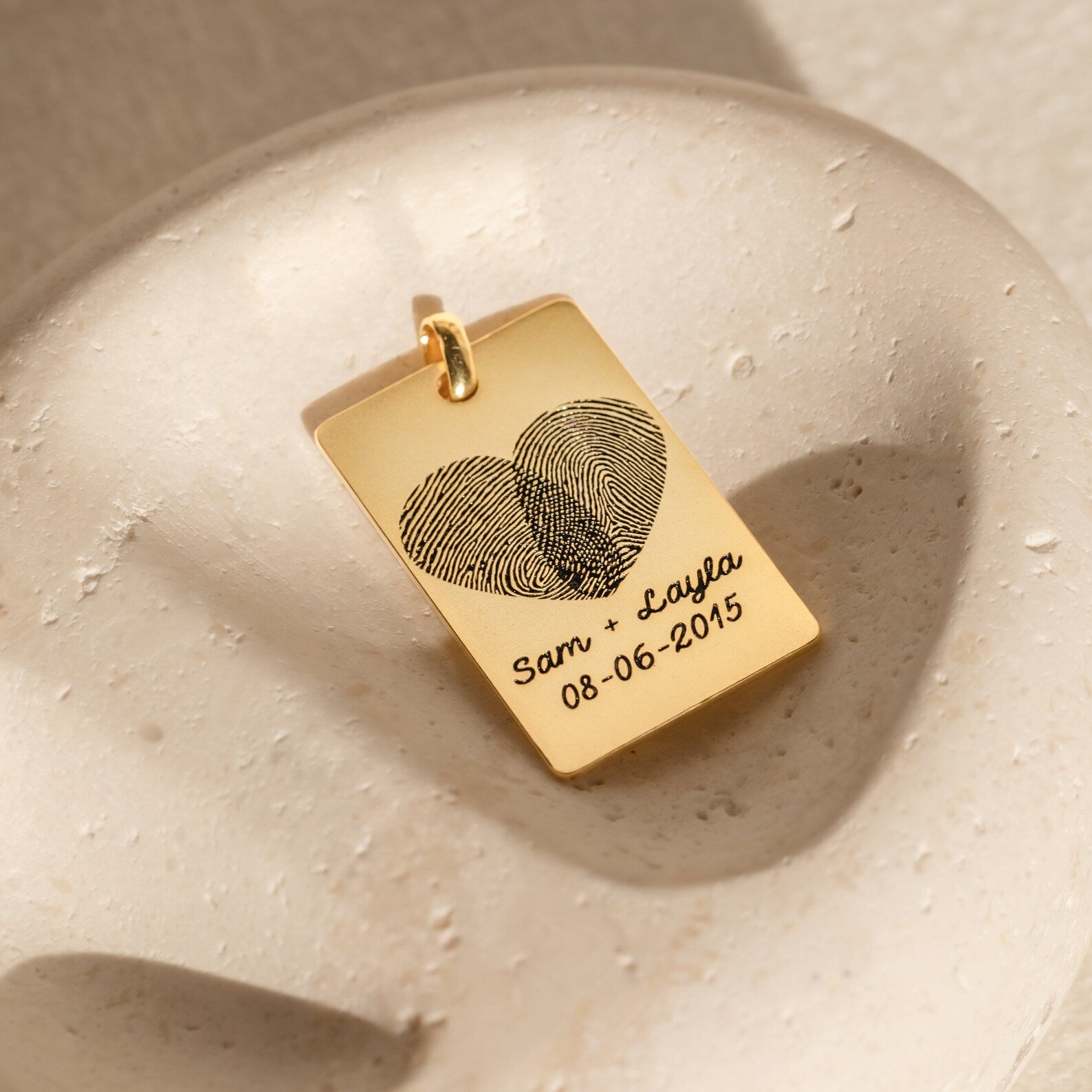 Fingerprint Rectangle Keychain engraved with two fingerprints forming a heart and Sam + Layla 08-06-2015—a personalized keepsake capturing your love and memories forever.