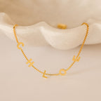 Alex Slider Bracelet in Box Chain, elegantly displayed on a white clam-shaped dish—a stunning piece of customizable jewelry and a thoughtful, unique gift.