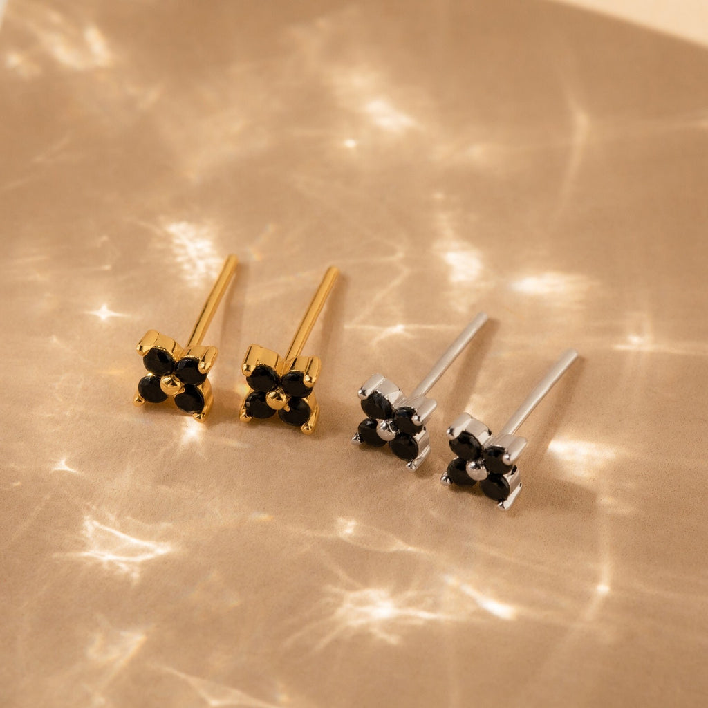 A collection of vintage earrings with black stones, including the elegant Black Flower Studs inspired by Art Deco jewelry.