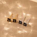 A collection of vintage earrings with black stones, including the elegant Black Flower Studs inspired by Art Deco jewelry.