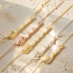 Four Minimal Sideways Name Necklaces in gold and silver, personalized with Olivia, Dakota, Riley, and Elena, rest on a beige stone surface—each dainty accessory features an elegant sideways design.
