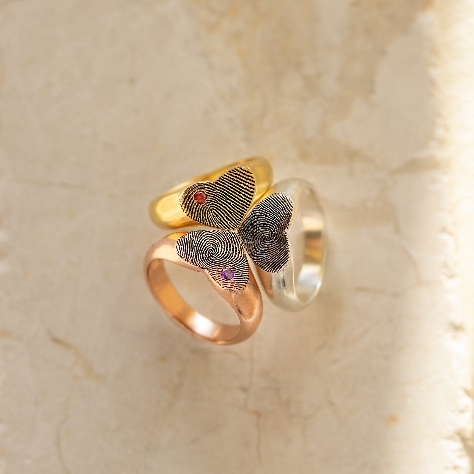 The Fingerprint Heart Signet Ring comes in gold, rose gold, and silver, each with your unique fingerprint and a gemstone—an unforgettable gift for mom.
