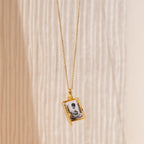 The Onyx Locket Necklace features a rectangular picture locket charm with a small black and white photo—an ideal choice for a personalized gift.