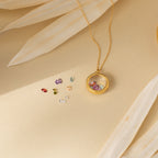 Crystal Locket Necklaces feature a gold chain with a round glass pendant and colorful gemstones, creating a beautiful keepsake accessory to hold cherished memories.