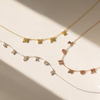 The Old English Letter Name Necklace, available in gold, silver, and rose gold finishes, is displayed on a light background—perfect for lovers of minimalist jewelry with a personalized touch.