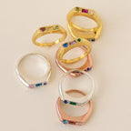 The Bold Birthstone Signet Ring in Rose Gold features a customizable gemstone, highlighting the beauty of personalized jewelry on a light background.