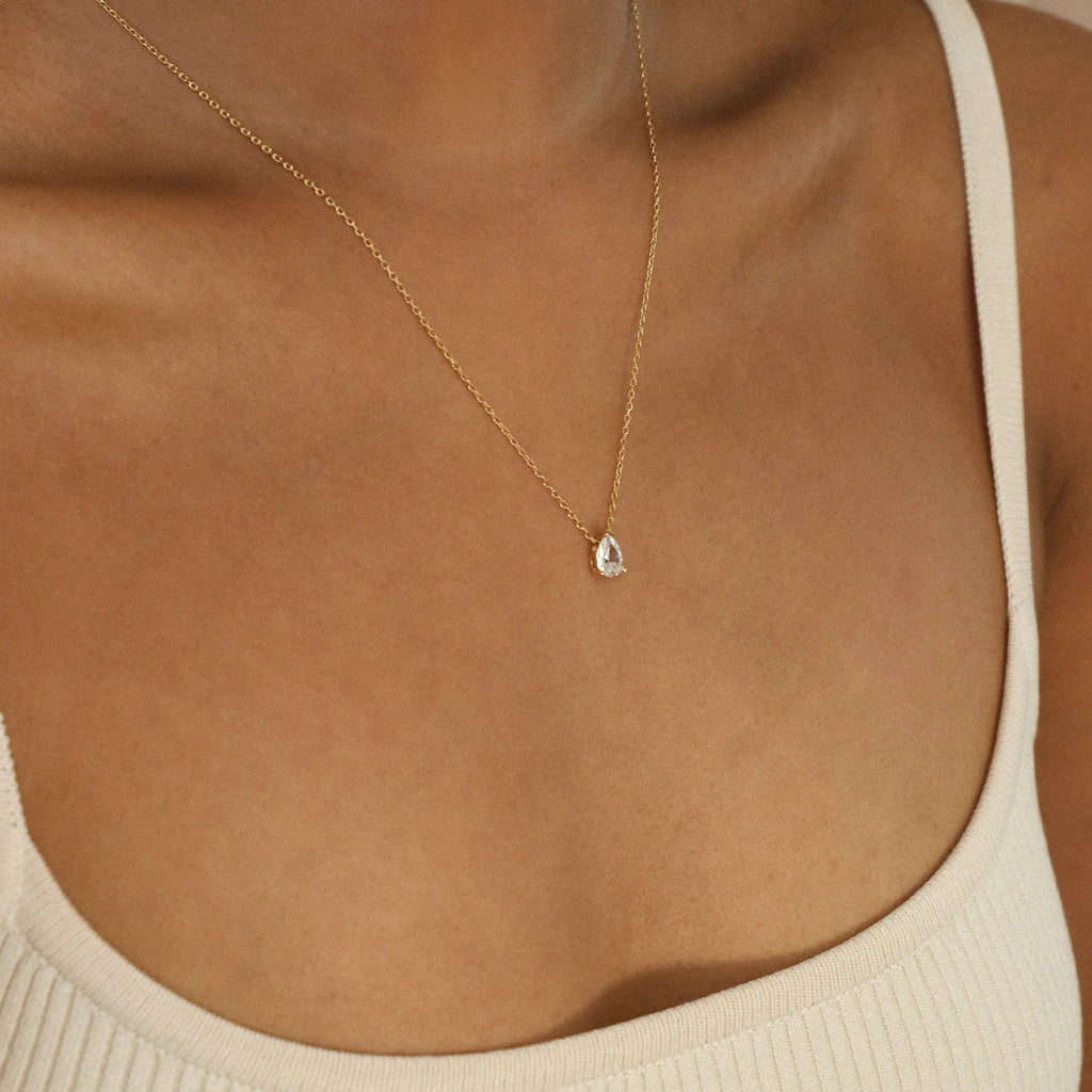 Rae Diamond Necklace delicate gold chain with small sparkling diamond pendant.