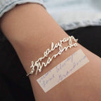 The Handwriting Bracelet in silver features "love always, Grandma" in cursive, replicating a handwritten note on your wrist—ideal as memorial jewelry or an everyday reminder of your loved one.