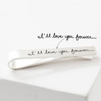 The Handwriting Tie Clip is a customizable silver tie clip engraved with "I'll love you forever..."—a unique, personalized gift for someone special.