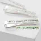 A silver Handwriting Tie Clip engraved with "Daddio, you are our inspiration."—a memorable personalized gift.