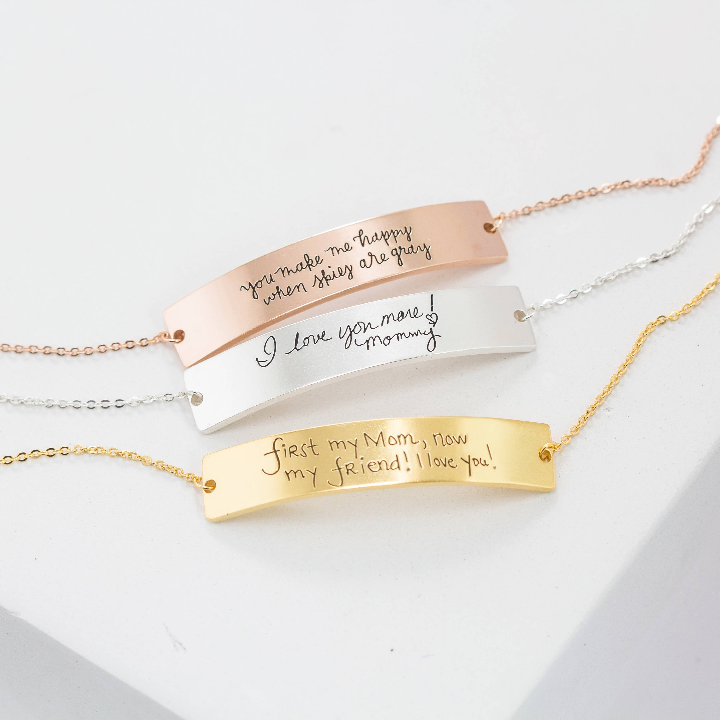 Three Handwriting Bar Bracelets in rose gold, silver, and gold with custom messages displayed on a white surface—meaningful personalized jewelry for thoughtful gifting.