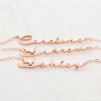 Three rose gold Minimal Name Necklaces—each personalized with Caroline, Andrew, and Ashley—displayed on a light background; perfect for lovers of dainty jewelry.