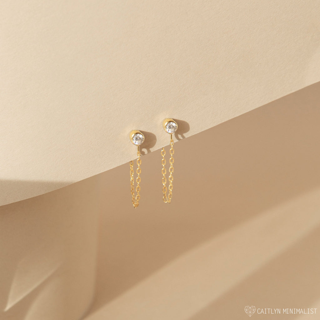 Birthstone Chain Studs featuring small round stones on a beige background, with light and shadow creating a soft effect—versatile earrings perfect for everyday wear or as a personalized gift.