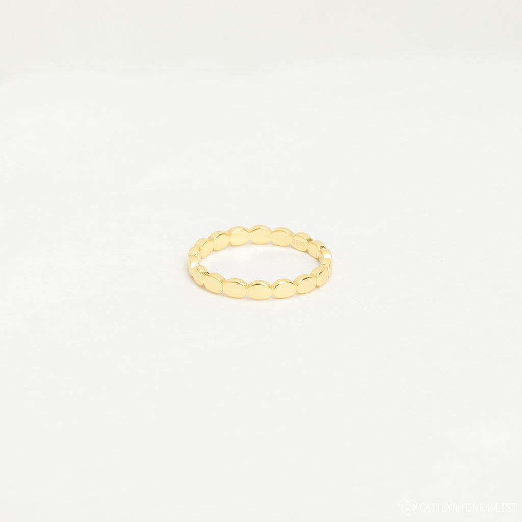 The Beaded Ring features a simple gold beaded design with a textured finish, ideal for stacking. Shown against a plain white background.