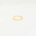 The Beaded Ring features a simple gold beaded design with a textured finish, ideal for stacking. Shown against a plain white background.