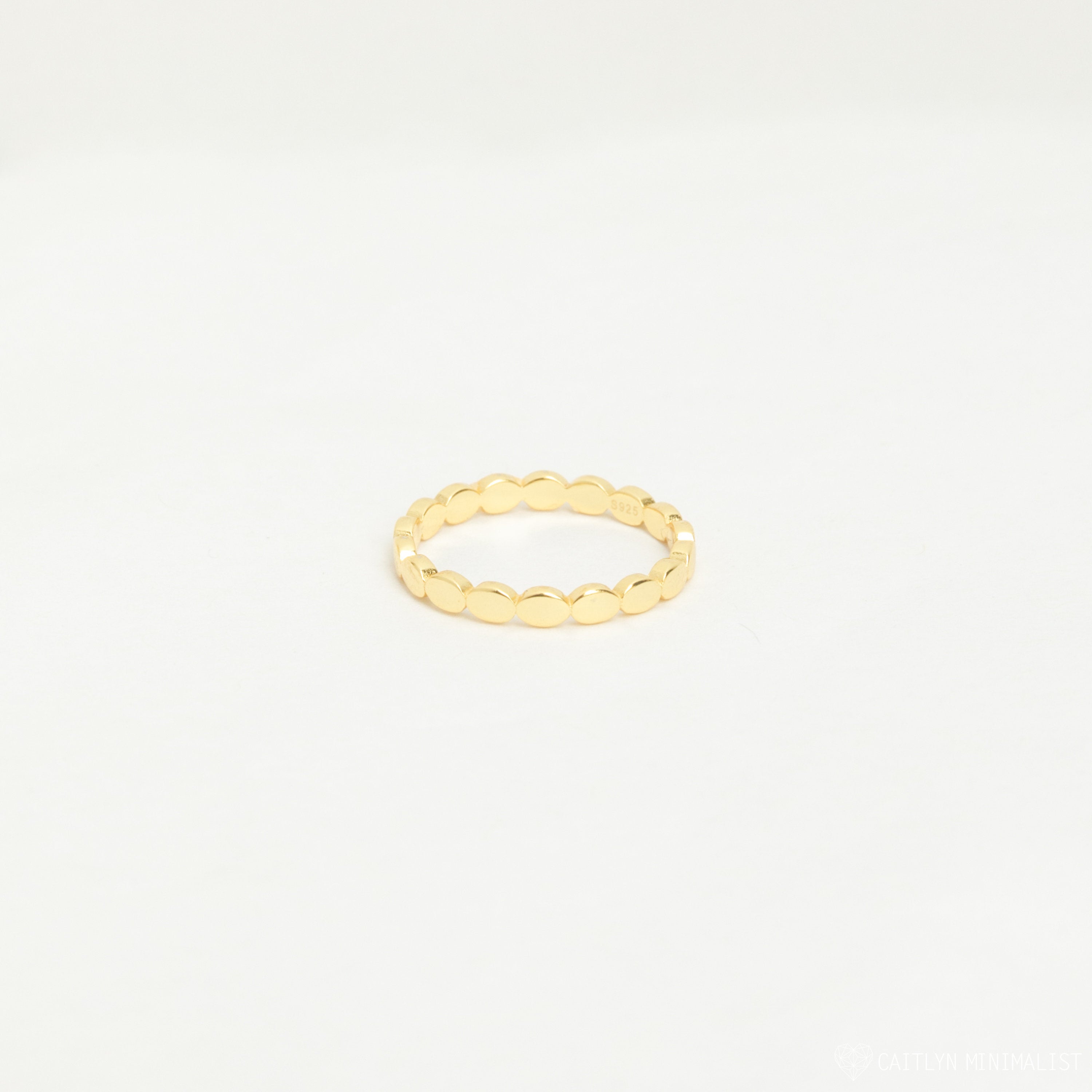 The Beaded Ring features a simple gold beaded design with a textured finish, ideal for stacking. Shown against a plain white background.