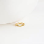 The Curb Chain Ring sits on a white surface with a minimalist backdrop, exuding subtle goth glam vibes.