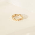 The Curb Chain Ring is shown on a light-colored surface with soft shadows, making it the perfect goth glam jewelry piece to elevate your style.