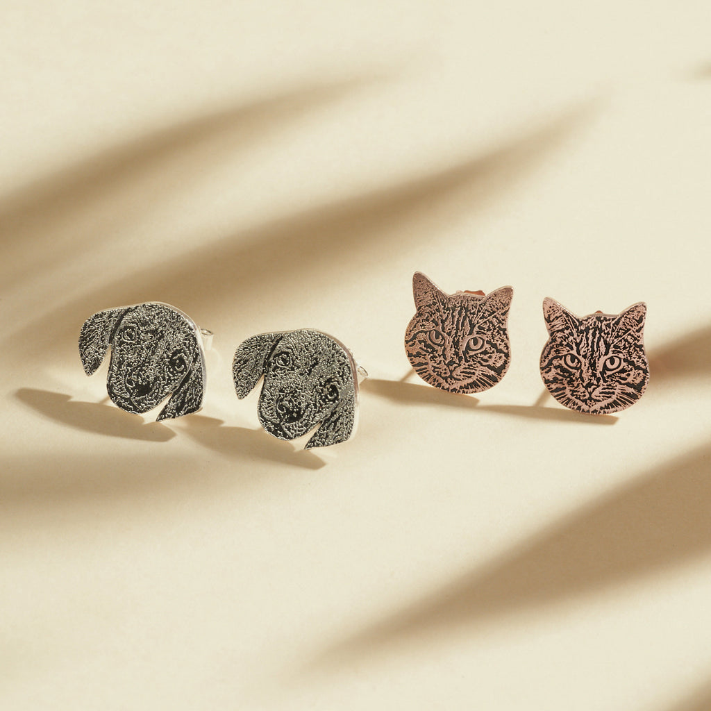 Pet Portrait Studs feature two pairs of stud earrings—one dog-faced and one cat-faced—making them perfect jewelry for pet lovers. These custom earrings add a playful touch to any outfit.