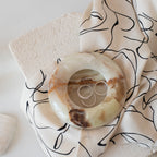 A plate displaying the elegant Pave Dome Ring.