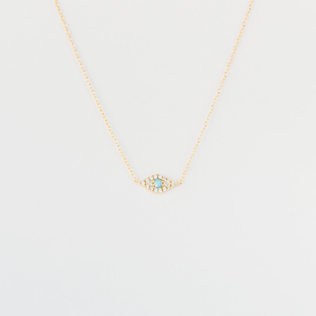 Opal Eye Necklace: Gold chain necklace with a small 925 sterling silver eye pendant set with turquoise and clear stones, shown on a white background.