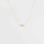 Opal Eye Necklace: Gold chain necklace with a small 925 sterling silver eye pendant set with turquoise and clear stones, shown on a white background.