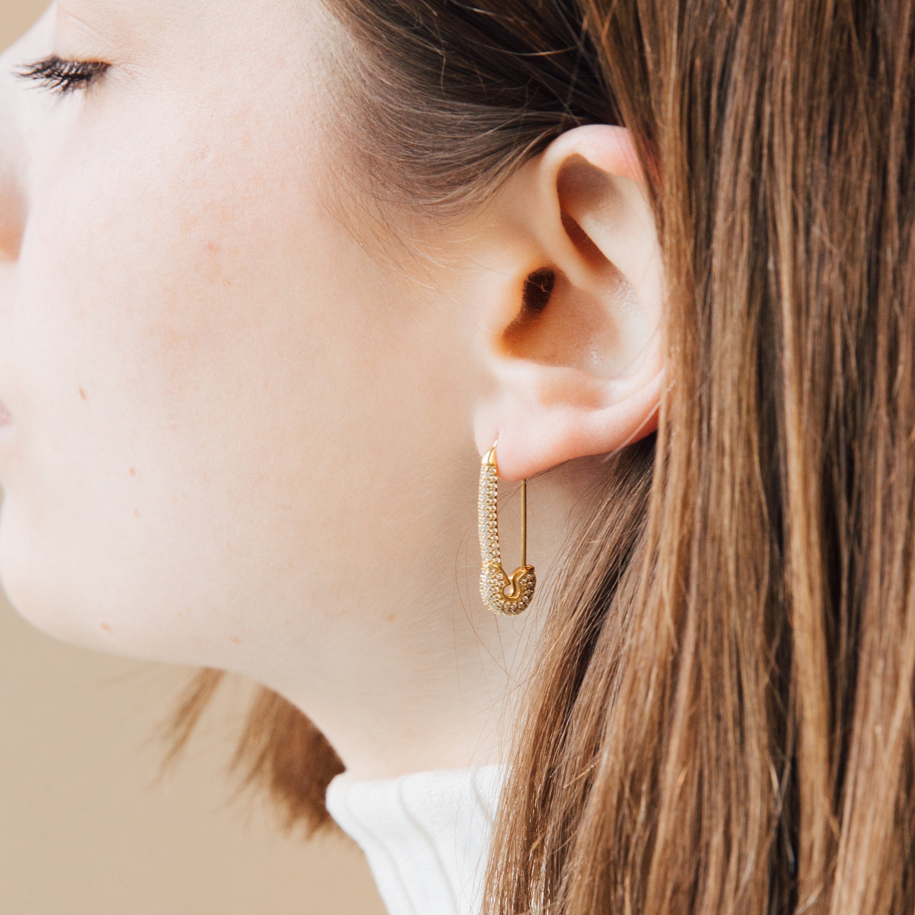 Close-up of a woman wearing a Safety Pin Earrings Set—perfect for those who love unique statement earrings.