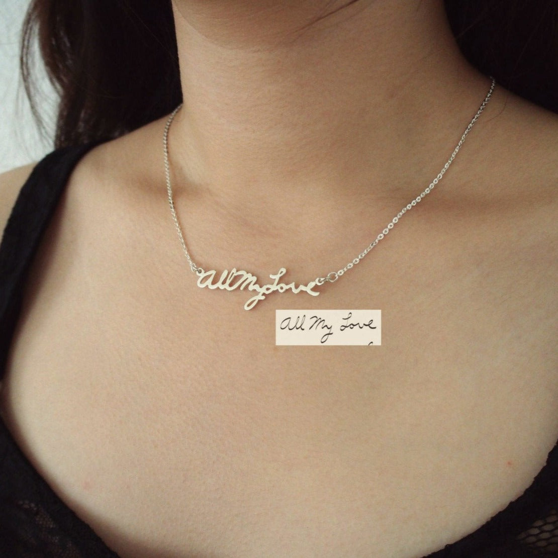 The Handwriting Necklace features “All my love” in silver cursive, personalized from your handwritten note—a sentimental keepsake she’ll cherish.